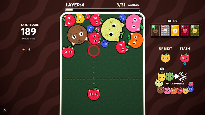 Catomi screenshot: aiming a strawberry cat into a pile of fruit on Layer 4